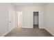 Cozy bedroom featuring plush carpeting, walk-in closet and ensuite bathroom at 271 W Amber Oak Dr, Selma, NC 27576