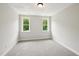 Bedroom with soft carpet and large windows providing natural light at 271 W Amber Oak Dr, Selma, NC 27576