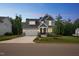 Beautiful two-story home with a two-car garage, manicured lawn, and inviting front porch at 271 W Amber Oak Dr, Selma, NC 27576