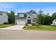 Charming two-story home with a manicured lawn and a welcoming two-car garage at 271 W Amber Oak Dr, Selma, NC 27576