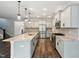Modern kitchen featuring stainless steel appliances, granite countertops, and a large island at 271 W Amber Oak Dr, Selma, NC 27576