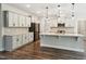 Bright kitchen with white cabinets, granite countertops, subway tile backsplash and a kitchen island at 271 W Amber Oak Dr, Selma, NC 27576