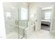 Bright bathroom with tiled shower and soaking tub, with access to the Primary bedroom at 2918 Heirloom Way, Apex, NC 27502