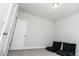 A bedroom with two black floor pillows, white walls, and a closet at 2918 Heirloom Way, Apex, NC 27502