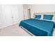 Bright bedroom features plush carpeting, a comfortable bed, and a door with direct access to closet at 2918 Heirloom Way, Apex, NC 27502