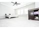 Spacious bedroom has a ceiling fan, plush carpet, and many windows for lots of natural light at 2918 Heirloom Way, Apex, NC 27502