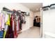 A walk-in closet with an abundance of clothes, accessories, and luggage at 2918 Heirloom Way, Apex, NC 27502