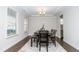 Elegant dining room with a tray ceiling, chandelier, and a stylish area rug at 2918 Heirloom Way, Apex, NC 27502