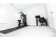 Bright room with full home gym, desk and chair, with two windows and plush carpet at 2918 Heirloom Way, Apex, NC 27502