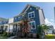 Attractive two-story home featuring a covered front porch and vibrant landscaping at 2918 Heirloom Way, Apex, NC 27502