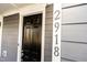 Close-up of the elegant black front door with the house number displayed prominently at 2918 Heirloom Way, Apex, NC 27502