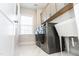 Modern laundry room features sleek washer/dryer set, sink and ample cabinet space at 2918 Heirloom Way, Apex, NC 27502
