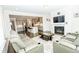 Living room with a fireplace and leather reclining sofas at 2918 Heirloom Way, Apex, NC 27502