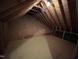 Spacious attic featuring wood beams and plank flooring, ready for storage or customization at 3110 Fieldstone Ln, Mebane, NC 27302