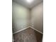 A cozy walk-in closet with carpeted floors offers space for storage at 3110 Fieldstone Ln, Mebane, NC 27302