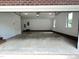 Clean and spacious two-car garage with brick trim, ready for vehicles and storage at 3110 Fieldstone Ln, Mebane, NC 27302