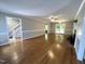 Expansive living room with hardwood floors, a fireplace, and seamless flow to other areas at 3110 Fieldstone Ln, Mebane, NC 27302