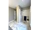 Walk-in shower with hexagon tile flooring and white door access at 3110 Fieldstone Ln, Mebane, NC 27302