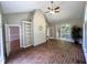 Sunroom with brick flooring, natural light, built-in bookshelves, and a view of the exterior at 3110 Fieldstone Ln, Mebane, NC 27302
