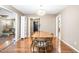 Dining room with hardwood floors and views into the living room and entry hall at 318 Fieldstone Dr, Burlington, NC 27215