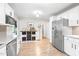 Bright kitchen featuring stainless steel appliances, white cabinets, and an open design at 318 Fieldstone Dr, Burlington, NC 27215