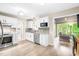 Well-lit kitchen featuring white cabinetry, stainless steel appliances, and granite countertops at 318 Fieldstone Dr, Burlington, NC 27215