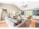 Spacious living room with hardwood floors, built-in shelving, and plenty of natural light at 318 Fieldstone Dr, Burlington, NC 27215