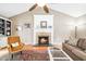 Inviting living room with a fireplace, hardwood floors, and a large decorative rug at 318 Fieldstone Dr, Burlington, NC 27215