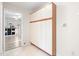 Functional mudroom with ample white cabinets, offering storage and access to other areas of the home at 318 Fieldstone Dr, Burlington, NC 27215