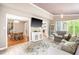 Open-concept living space with dining area and sun room, perfect for entertaining guests at 318 Fieldstone Dr, Burlington, NC 27215