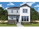 New two-story home boasts modern design, brick accents, covered entry, and professional landscaping at 339 Parkland Dr, Pittsboro, NC 27312