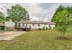 Spacious backyard with a deck and lush green lawn, perfect for recreation at 3620 Constellation Dr, Raleigh, NC 27604
