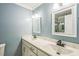 Bright bathroom featuring dual sinks with marble countertops, and updated fixtures at 3620 Constellation Dr, Raleigh, NC 27604