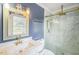 Beautiful bathroom features a modern vanity and a glass shower with gold fixtures at 3620 Constellation Dr, Raleigh, NC 27604