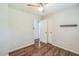 Bedroom with hardwood floors, neutral walls, ceiling fan, and closet at 3620 Constellation Dr, Raleigh, NC 27604