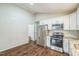 Kitchen with hardwood floors and stainless steel appliances at 3620 Constellation Dr, Raleigh, NC 27604
