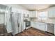 Modern kitchen with stainless steel appliances and white cabinets and granite countertops at 3620 Constellation Dr, Raleigh, NC 27604