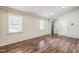 Bright living room boasts hardwood floors, recessed lighting and two large windows at 3620 Constellation Dr, Raleigh, NC 27604