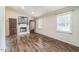 Spacious living room features a fireplace, hardwood floors, and plenty of natural light at 3620 Constellation Dr, Raleigh, NC 27604