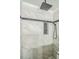 Elegant walk-in shower featuring marble tile walls, a rainfall shower head and a convenient niche at 3620 Constellation Dr, Raleigh, NC 27604