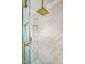 Modern shower with glass door, overhead rain shower head and marble wall tiles at 3620 Constellation Dr, Raleigh, NC 27604