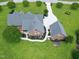 Beautiful home featuring meticulously landscaped yard, charming brick exterior, detached garage, and long driveway at 4005 Olde Waverly Way, Fuquay Varina, NC 27526