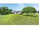 Aerial view showcasing the home's landscaped yard and pristine curb appeal at 4005 Olde Waverly Way, Fuquay Varina, NC 27526