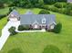 Aerial view highlighting the home's landscaped yard, mature trees, and curb appeal at 4005 Olde Waverly Way, Fuquay Varina, NC 27526