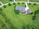 Charming property boasts a well-manicured lawn, mature landscaping, a brick home and separate garage at 4005 Olde Waverly Way, Fuquay Varina, NC 27526