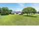 Aerial view highlighting the home's mature landscaping and two car garage at 4005 Olde Waverly Way, Fuquay Varina, NC 27526