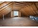 The attic is spacious and has a window for natural light and an HVAC system at 4005 Olde Waverly Way, Fuquay Varina, NC 27526