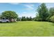 Expansive front yard with lush green lawn and mature trees at 4005 Olde Waverly Way, Fuquay Varina, NC 27526