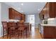 Bright kitchen with wooden cabinets, island, breakfast bar and stainless steel appliances at 4005 Olde Waverly Way, Fuquay Varina, NC 27526