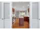 Bright kitchen with hardwood floors, stainless steel appliances and a kitchen island at 4005 Olde Waverly Way, Fuquay Varina, NC 27526
